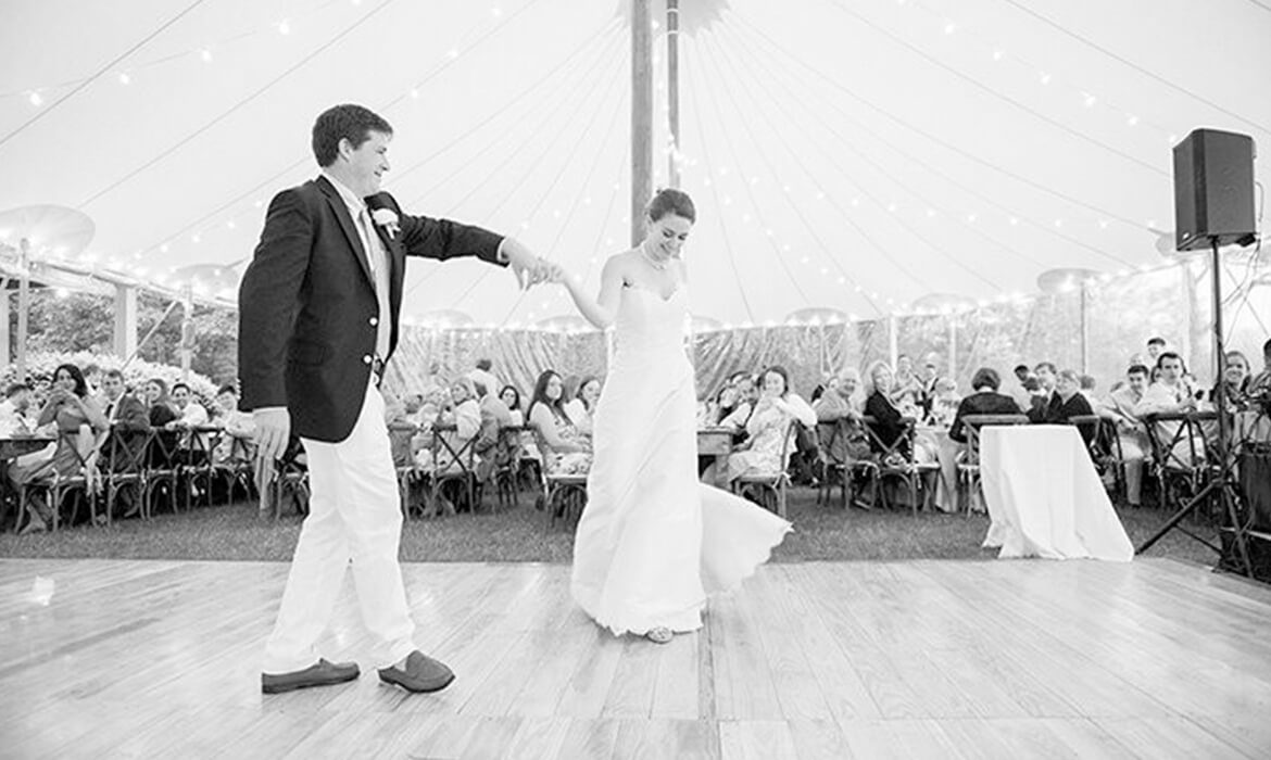 Dancing on a wedding dance floor rental