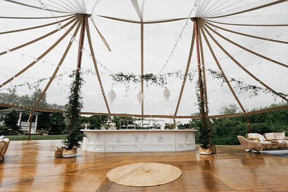 Dance floor and bar under wedding tent rental