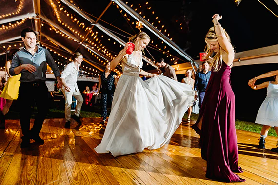 Wedding dance party under clear tent