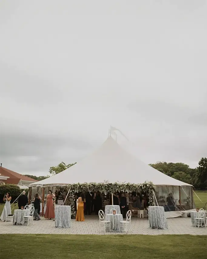 Outdoor wedding reception tent and seating area