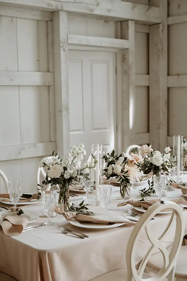Wedding table with plates and dining pieces